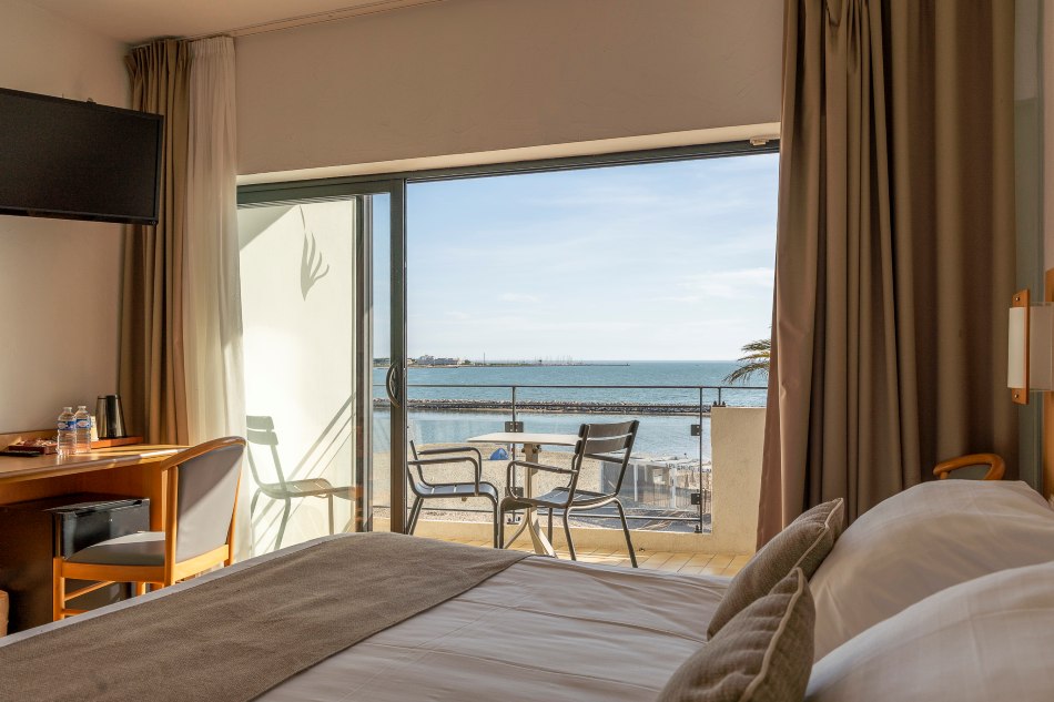 room with balcony and seaview