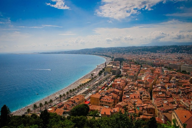 A view from castle hill over Nice red rooftops and extensive stretch of blue Mediterranean Sea