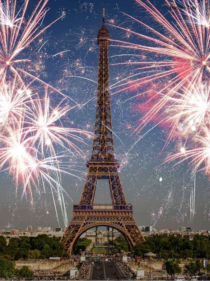 Eiffel Tower illuminated with fireworks during a Bastille Day celebration