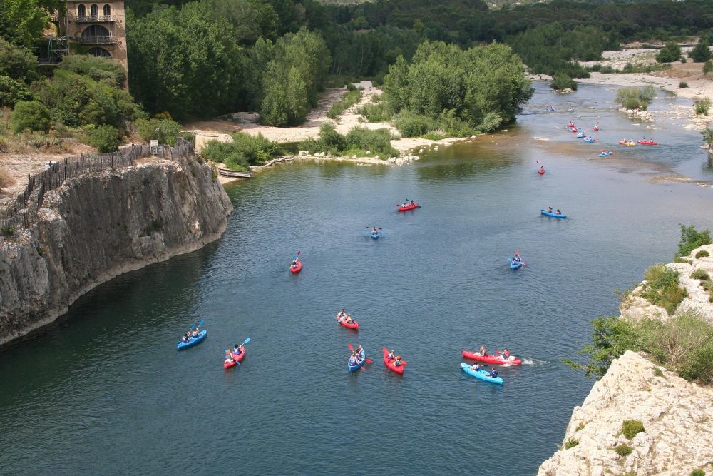 Group of people Kayaking on the Gardon river in Southern France